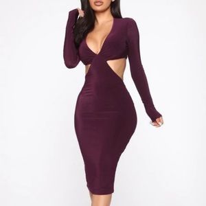 Beautiful, purple, snug fitting dress that has never been worn .